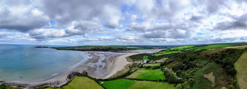 Wide panoramic aerial view of Poppit Sands bay