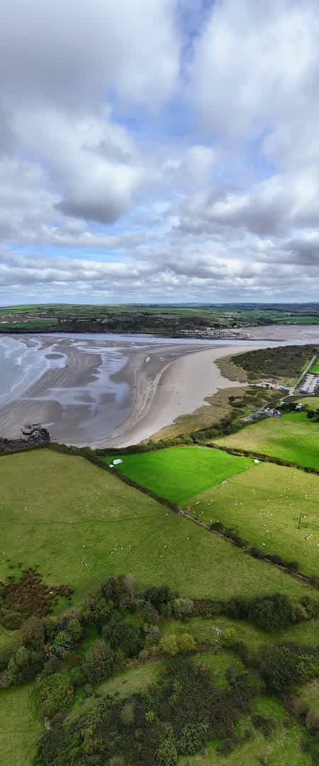 Tall portrait aerial view of Poppit Sands