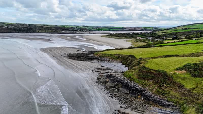 Coast and farmland near Poppit Sands from above